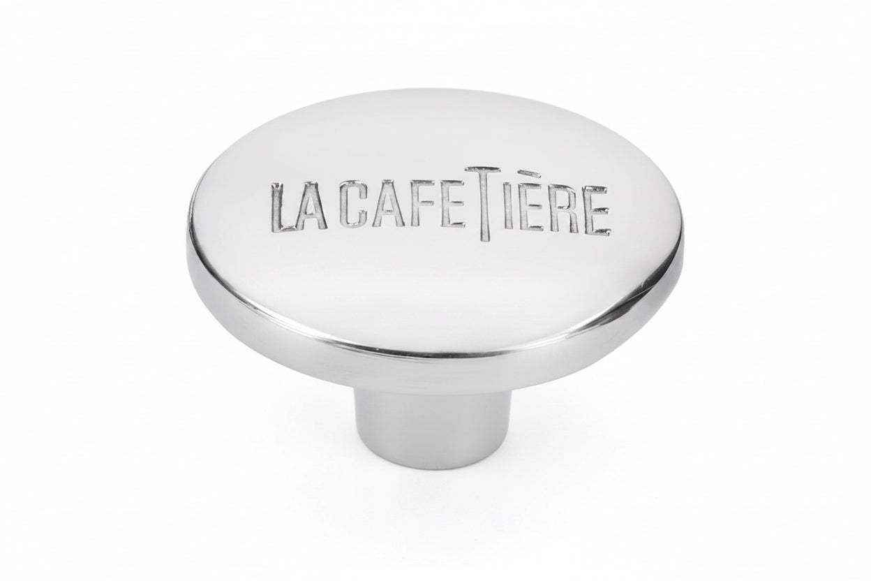 LA CAFETIÈRE UZGALIS NOSPIEDĒJA STIENIM, SUDRABA KR., N/T
