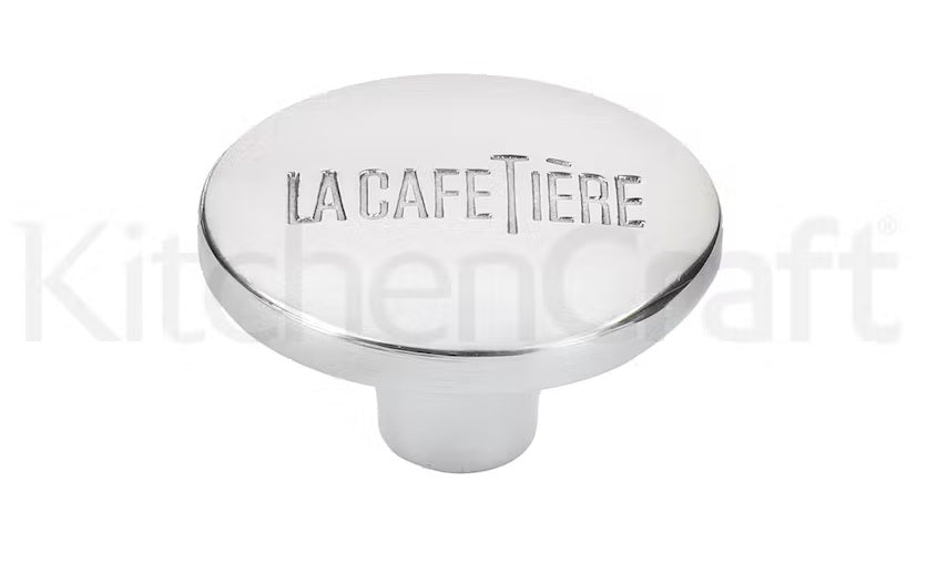 LA CAFETIÈRE UZGALIS NOSPIEDĒJA STIENIM, SUDRABA KR., N/T